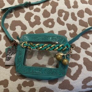 Myra Bag Teal Tooled Leather Crossbody charm and chain not included.